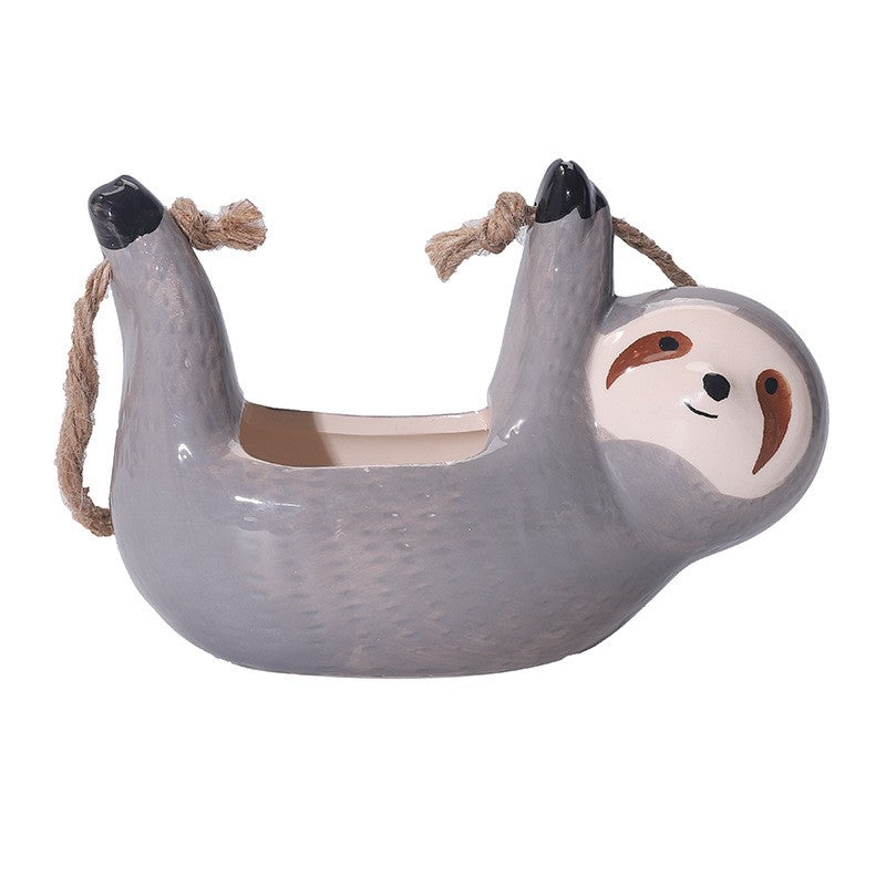 Vaso em formato de preguiça para pendurar plantas