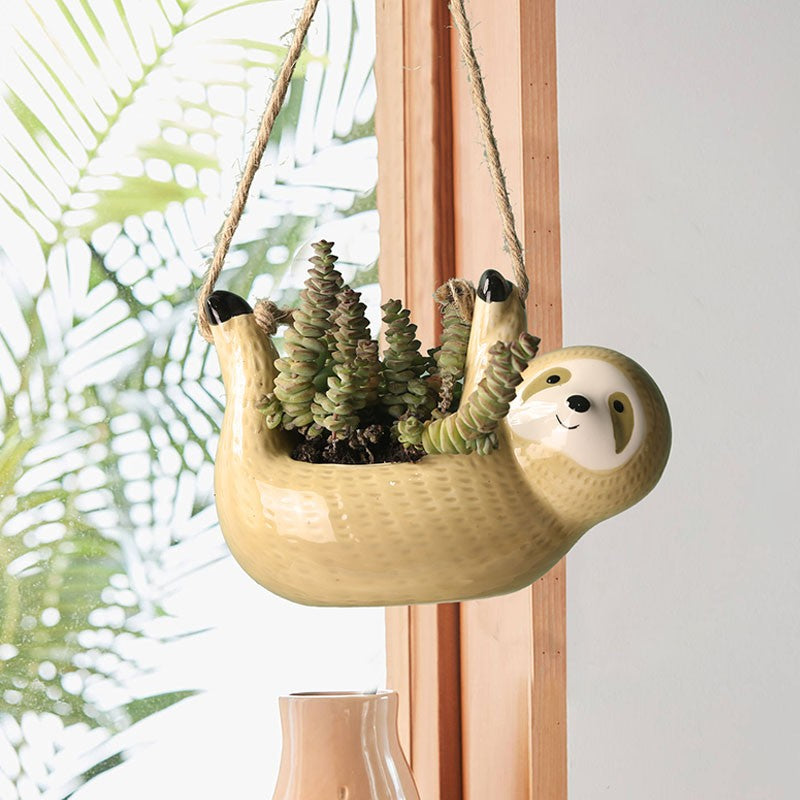 Vaso em formato de preguiça para pendurar plantas